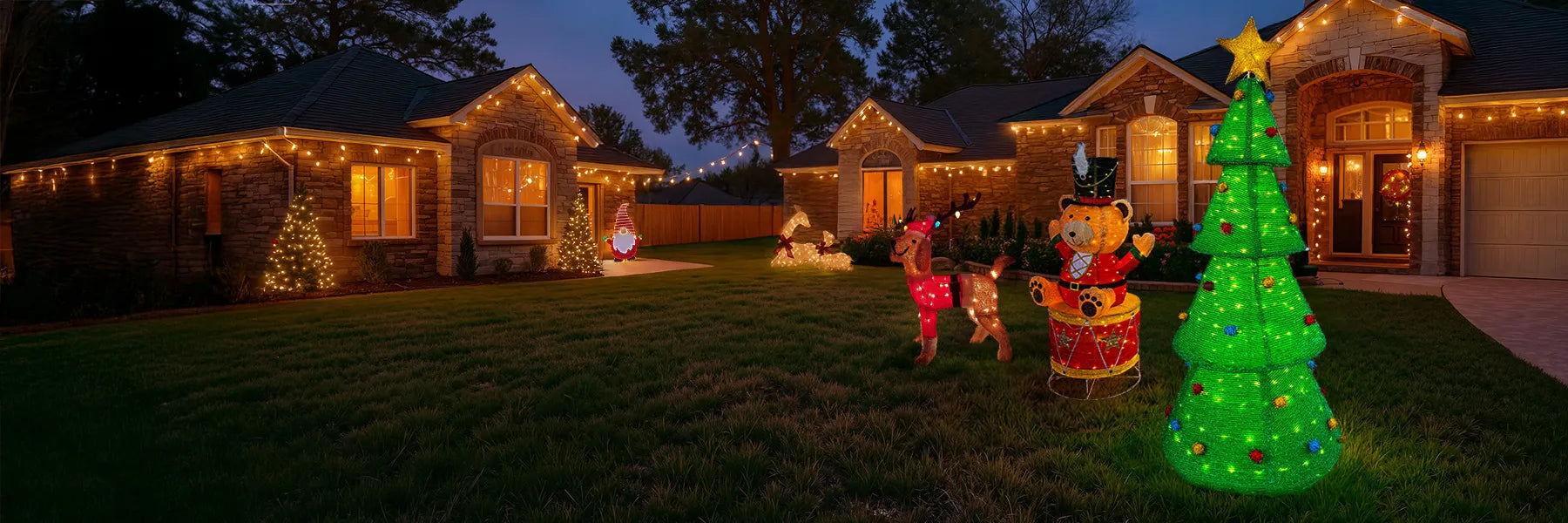 Decorative Christmas lights and inflatable figures on a house exterior at night.
