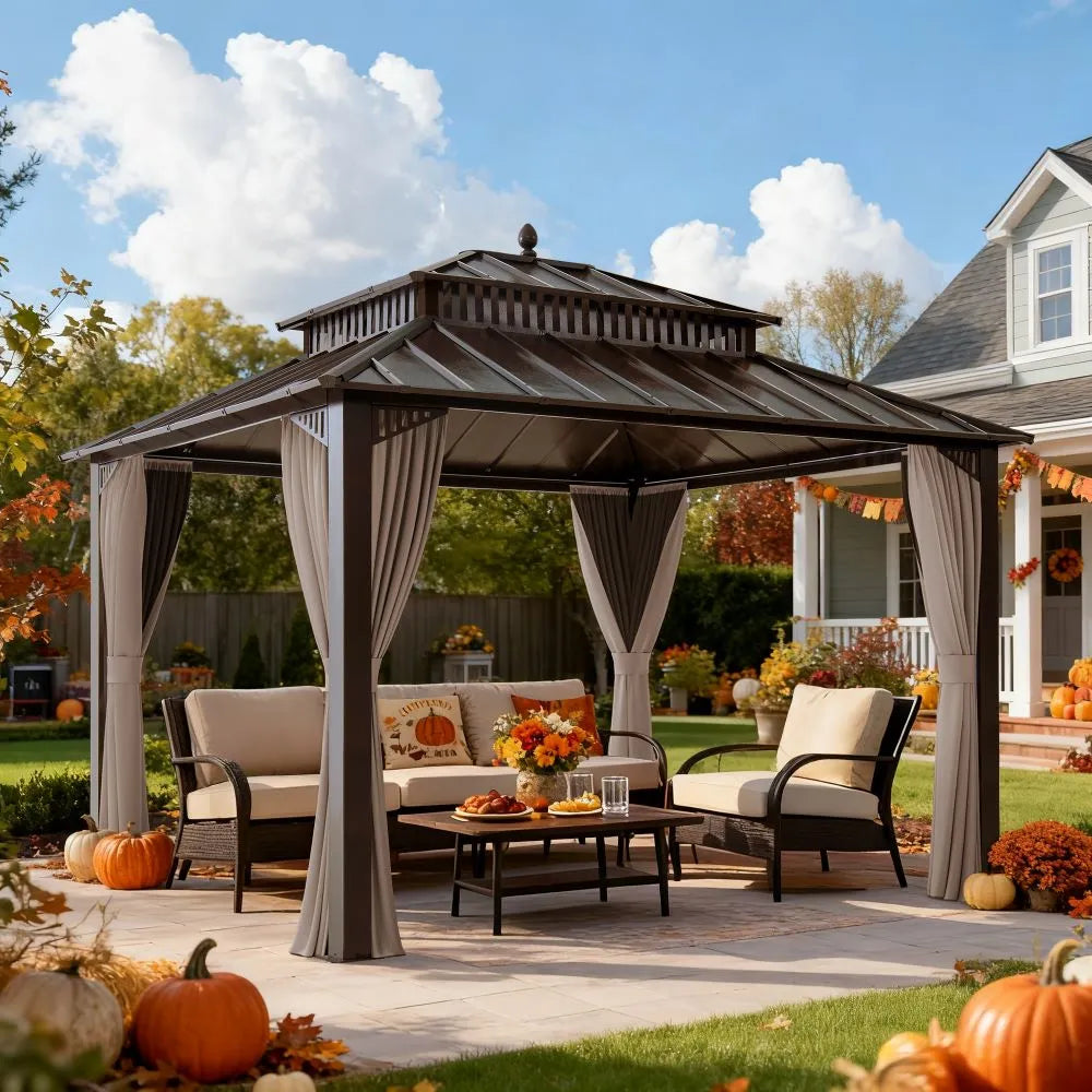 Patio with gazebo, outdoor furniture, and autumn decorations including pumpkins and flowers.
