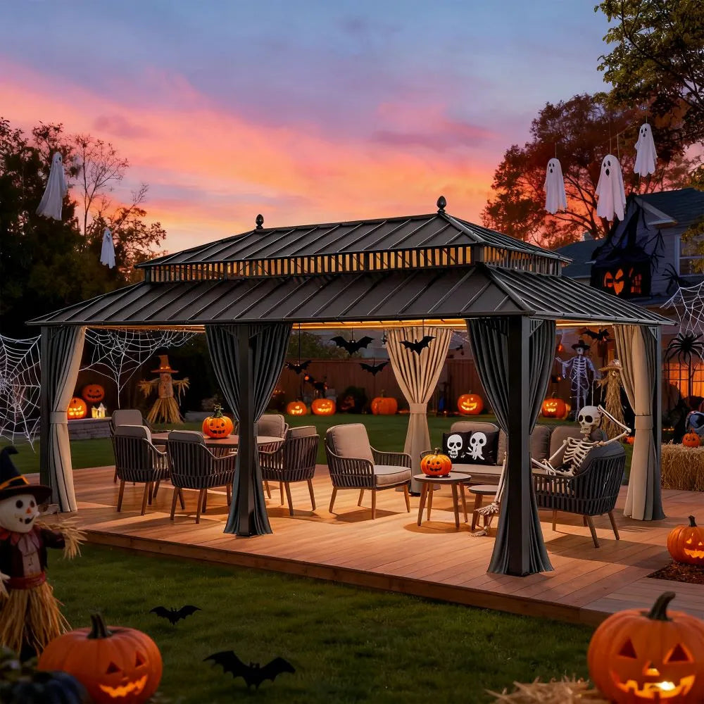 Outdoor Halloween-themed patio with pumpkins, ghosts, and skeletons against a colorful sunset.