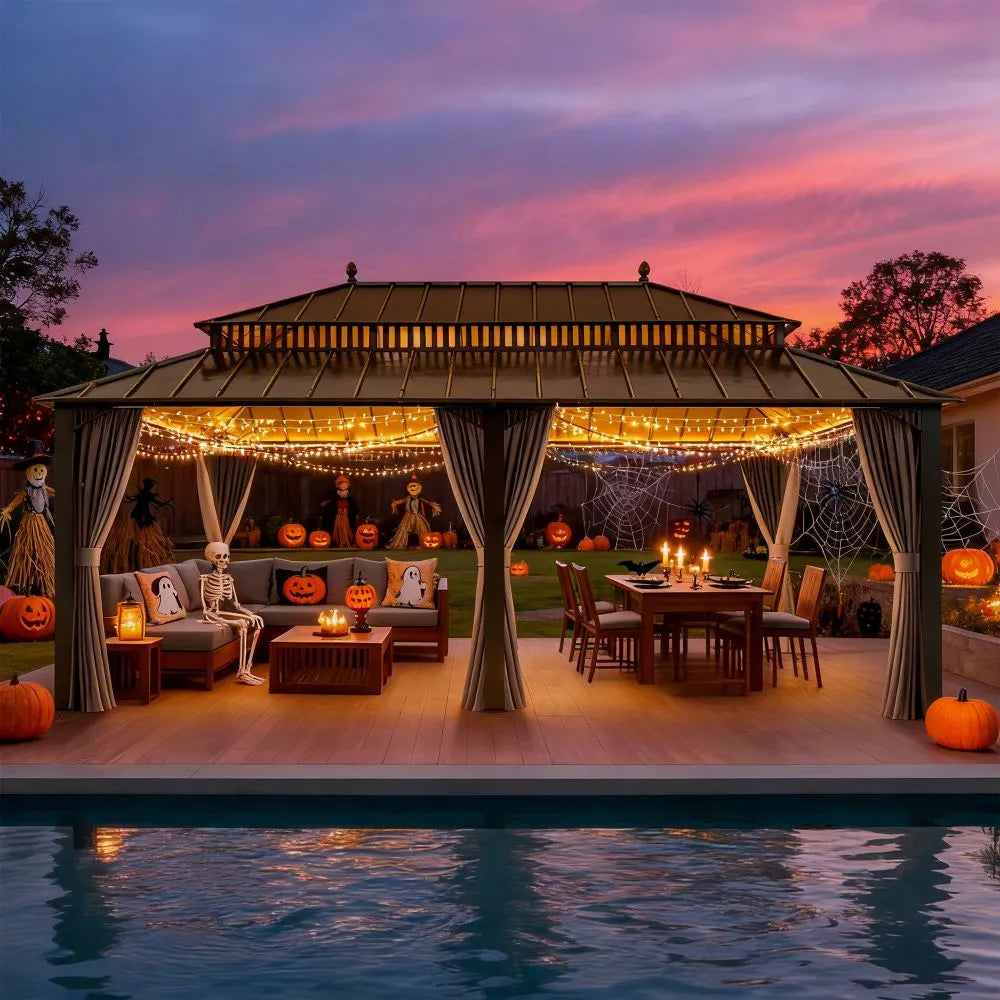 Outdoor gazebo decorated for Halloween with string lights, pumpkins, and a sunset sky.