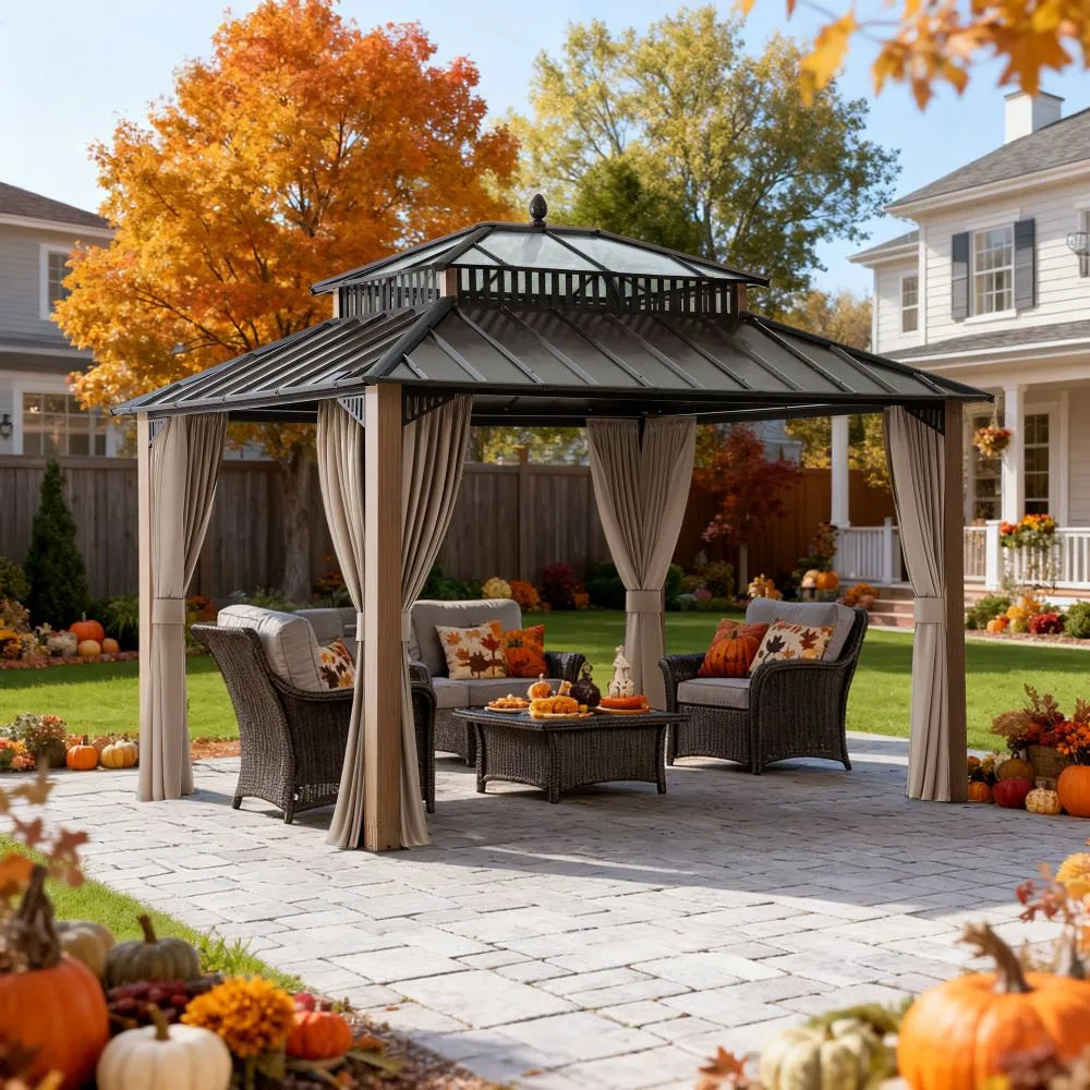 Outdoor gazebo with patio furniture and autumn decorations on a stone patio.