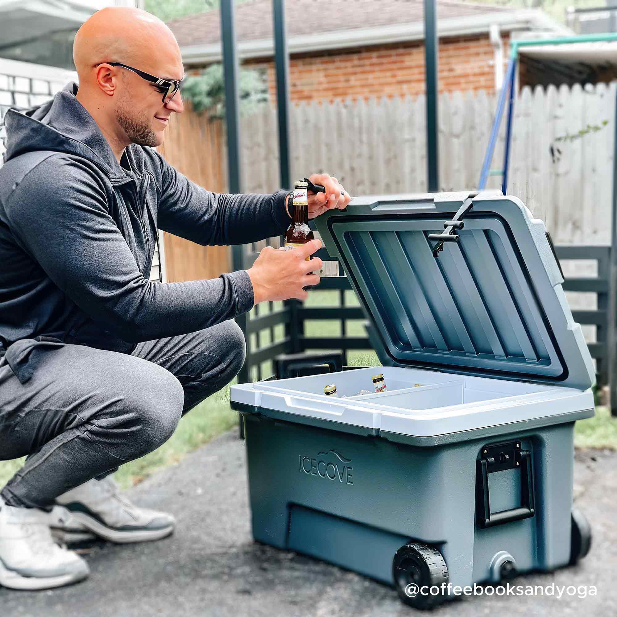Sunjoy 60-Quart Insulated Beach Ice Chest Solar Cooler with Wheels and Handles.