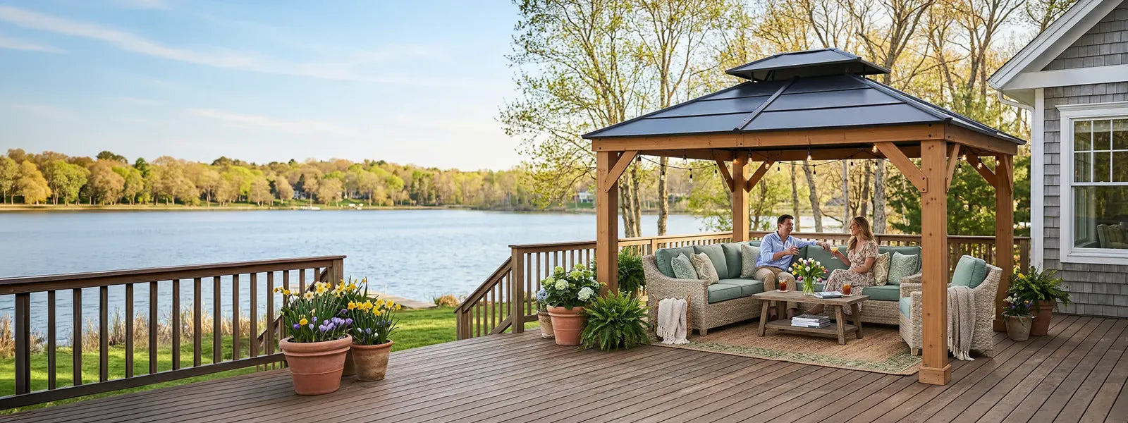 a couple seat under a sunjoy outdoor gazebos