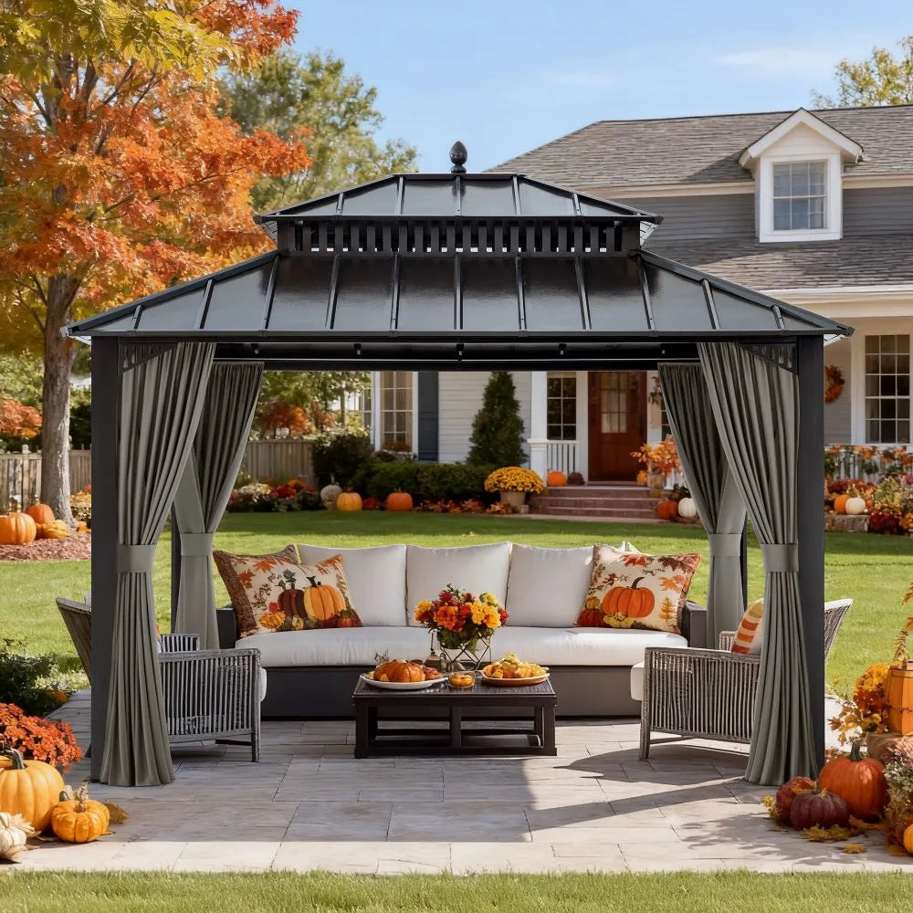 Outdoor gazebo with seating area decorated for fall in a residential backyard.
