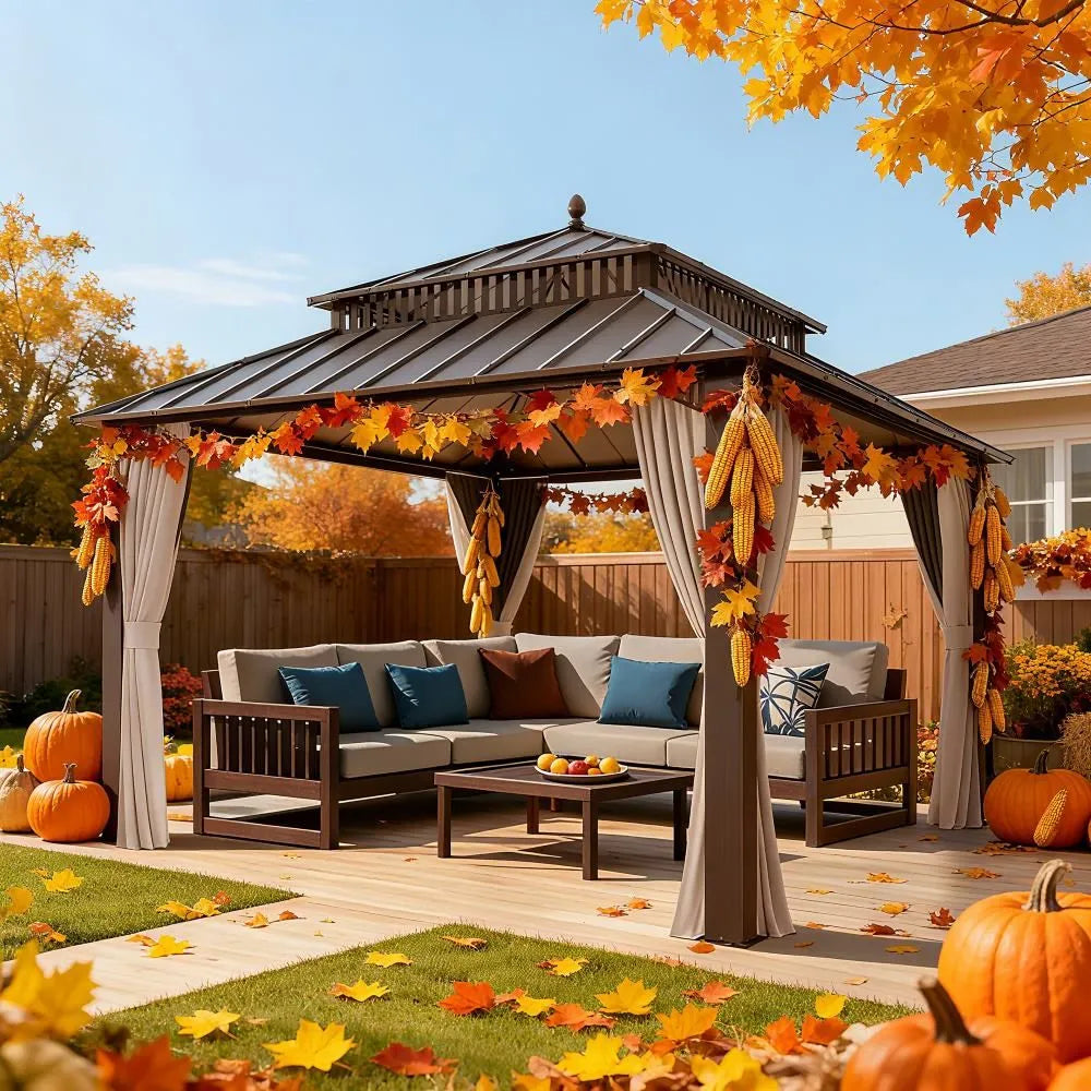 Decorated outdoor gazebo with fall decorations, pumpkins, and a clear blue sky.