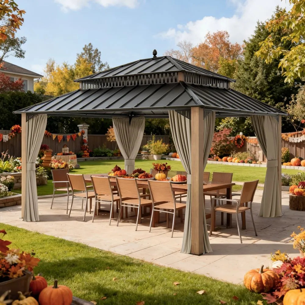 Outdoor gazebo with curtains, tables, and chairs in a garden setting with pumpkins and autumn decorations.