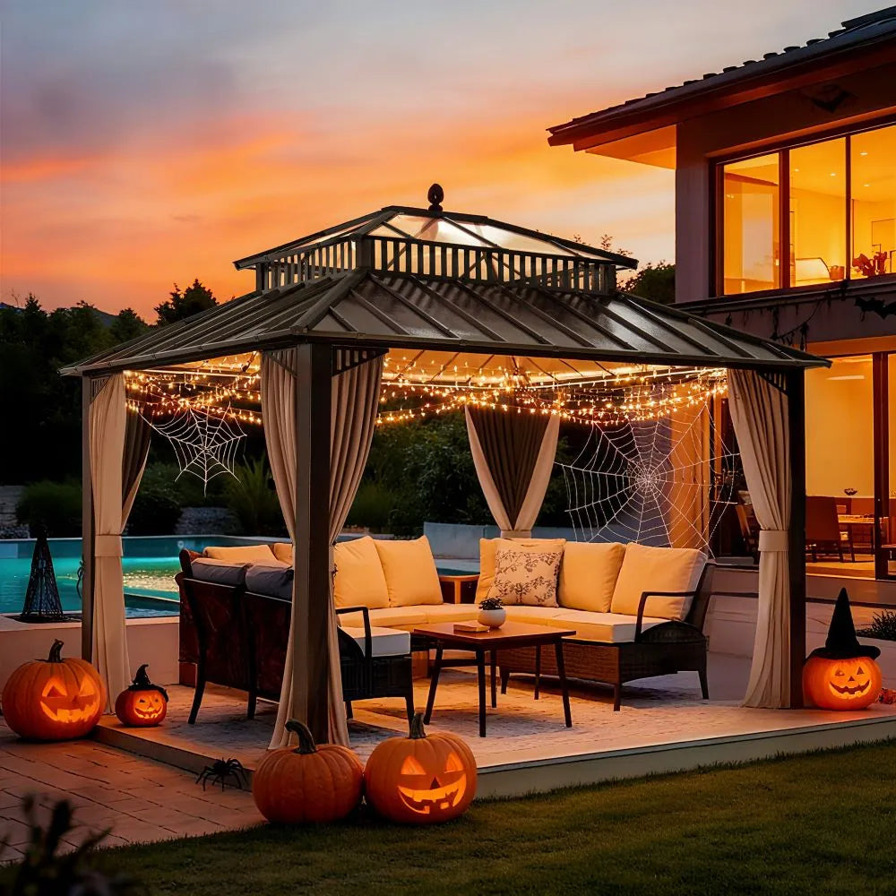 Outdoor gazebo decorated with Halloween decorations including pumpkins and string lights, set against a sunset sky.