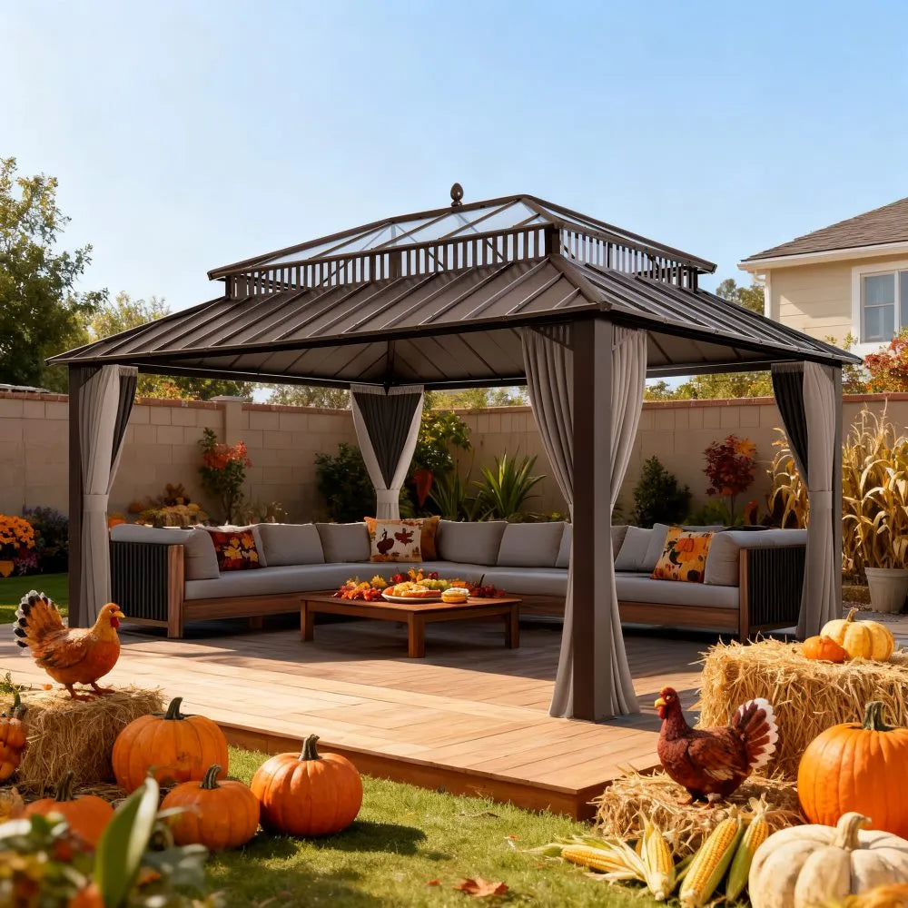 Outdoor gazebo with seating area, pumpkins, and corn on a sunny day.