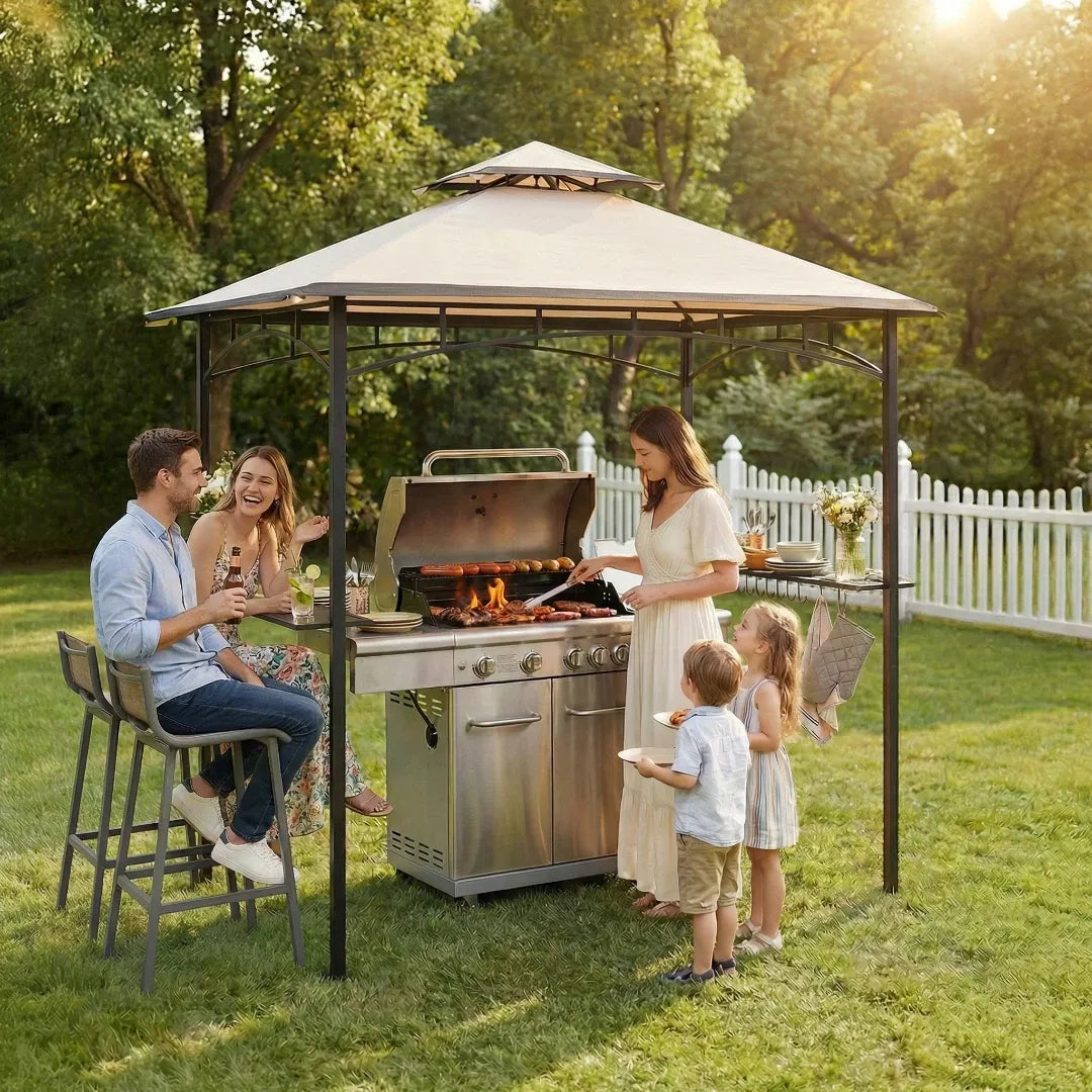 Family gathered around a barbecue grill under a gazebo in a backyard setting.